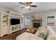Comfortable living room with a stone fireplace, entertainment center, and neutral decor at 1919 Madeira Cir, Waxhaw, NC 28173