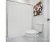 Clean bathroom featuring a shower with white curtain, toilet and tile flooring at 195 Linda St, Salisbury, NC 28146