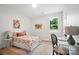 Well-lit bedroom featuring a floral patterned bedspread, work space, and natural light at 195 Linda St, Salisbury, NC 28146