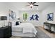 Cozy bedroom features a ceiling fan, natural light, and unique artwork at 195 Linda St, Salisbury, NC 28146