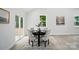 Bright dining room featuring contemporary design, a round table, and sliding glass doors for natural light at 195 Linda St, Salisbury, NC 28146