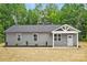 Charming single-story home featuring a gray exterior, simple landscaping, and a welcoming front porch at 195 Linda St, Salisbury, NC 28146