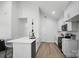 A beautifully appointed kitchen with white cabinetry, stainless appliances, quartz countertops, and an open design at 195 Linda St, Salisbury, NC 28146