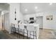 Bright kitchen features white cabinets, a large island with barstool seating and stainless steel appliances at 195 Linda St, Salisbury, NC 28146