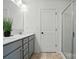 Bathroom featuring double sinks, neutral cabinets, a door to a shower, and neutral tile flooring at 2018 Crooked Oak Ln, York, SC 29745