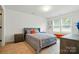 Cozy bedroom with soft lighting, neutral tones, and a comfortable queen-size bed at 2018 Crooked Oak Ln, York, SC 29745