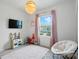 The room has soft pink and white tones, a faux cooking center, and lots of natural light at 2018 Crooked Oak Ln, York, SC 29745