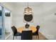 Bright dining area with modern lighting, round table, and sliding glass door to the patio at 2018 Crooked Oak Ln, York, SC 29745