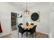 Bright dining area with modern lighting, round table, and sliding glass door to the patio at 2018 Crooked Oak Ln, York, SC 29745