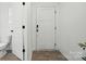 Clean entryway featuring a white door with a modern handle and a visible toilet at 2018 Crooked Oak Ln, York, SC 29745