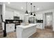 Modern kitchen with white cabinetry, stylish backsplash, and stainless-steel appliances at 2018 Crooked Oak Ln, York, SC 29745