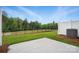 A large backyard with trees and a patio area, perfect for outdoor entertaining at 2021 Vinyasa Ln # Sts-41, Charlotte, NC 28215