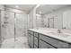 Modern bathroom featuring a glass enclosed shower and a double vanity with quartz countertops at 2021 Vinyasa Ln # Sts-41, Charlotte, NC 28215