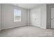 Comfortable bedroom with a bright window view and a double door closet at 2021 Vinyasa Ln # Sts-41, Charlotte, NC 28215