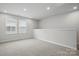 Large carpeted bonus room with lots of natural light at 2021 Vinyasa Ln # Sts-41, Charlotte, NC 28215
