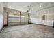 Spacious garage with an automatic door opener and ample room for parking and storage at 2021 Vinyasa Ln # Sts-41, Charlotte, NC 28215