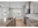 Bright kitchen featuring granite counters, stainless appliances, and ample cabinet space at 2021 Vinyasa Ln # Sts-41, Charlotte, NC 28215