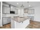 Modern kitchen with granite countertops, a kitchen island, stainless steel appliances, and gray cabinets at 2021 Vinyasa Ln # Sts-41, Charlotte, NC 28215