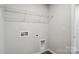 Laundry room with hookups and overhead wire rack at 2021 Vinyasa Ln # Sts-41, Charlotte, NC 28215