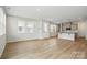 Open-concept living room featuring wood floors, and lots of natural light at 2021 Vinyasa Ln # Sts-41, Charlotte, NC 28215