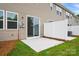 Back patio with sliding glass door and privacy fence at 2021 Vinyasa Ln # Sts-41, Charlotte, NC 28215
