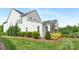 Well-maintained backyard with manicured landscaping and a lush green lawn at 2026 Thatcher Way, Fort Mill, SC 29715