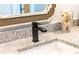 Close-up of a stylish bathroom vanity with granite countertop and modern black faucet at 2026 Thatcher Way, Fort Mill, SC 29715