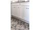 Bathroom vanity featuring decorative patterned tiles and white shaker cabinets at 2026 Thatcher Way, Fort Mill, SC 29715
