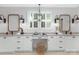 Bathroom featuring dual vanities, granite countertops, framed mirrors, and ample storage space at 2026 Thatcher Way, Fort Mill, SC 29715