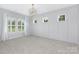 Inviting bedroom with neutral walls, plush carpet and bright shutters at 2026 Thatcher Way, Fort Mill, SC 29715