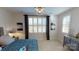 Bedroom showcasing neutral decor with bed, side table, chest and natural light at 2026 Thatcher Way, Fort Mill, SC 29715