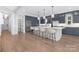 Well-appointed kitchen boasting a large island with seating, stainless steel appliances, and ample cabinet space at 2026 Thatcher Way, Fort Mill, SC 29715