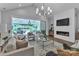Comfortable living room with fireplace and view to outdoor living and dining at 2026 Thatcher Way, Fort Mill, SC 29715