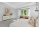 Bright main bedroom with a large window and a decorative dresser, styled for comfort and elegance at 2026 Thatcher Way, Fort Mill, SC 29715