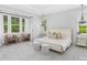 Spacious main bedroom with decorative wall panels, a cushioned bed, and large windows for natural light at 2026 Thatcher Way, Fort Mill, SC 29715