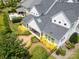 Aerial view showcases the home's meticulously landscaped backyard and outdoor living space with pool at 2026 Thatcher Way, Fort Mill, SC 29715