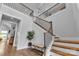 Elegant staircase featuring wooden steps, iron railings, and a stylish landing at 2026 Thatcher Way, Fort Mill, SC 29715