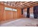 Unfinished basement with exposed beams ready for customization at 20392 Queens St, Cornelius, NC 28031