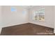 Bedroom with hardwood floors and ample natural light at 20392 Queens St, Cornelius, NC 28031