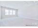 Large bonus room featuring recessed lighting, neutral carpeting and ample natural light at 20392 Queens St, Cornelius, NC 28031