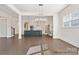 Bright open-concept kitchen featuring a large island, modern appliances, and stylish lighting at 20392 Queens St, Cornelius, NC 28031