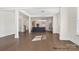 Bright open-concept kitchen featuring a large island, modern appliances, and stylish lighting at 20392 Queens St, Cornelius, NC 28031