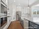 Stylish kitchen with stainless steel appliances and granite countertops at 20392 Queens St, Cornelius, NC 28031