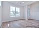 Bright living room with large windows and hardwood floors at 20392 Queens St, Cornelius, NC 28031