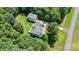 Expansive aerial view of the property showcasing the home, detached garage, lush greenery, and outdoor living spaces at 220 Glenville Dr, Fort Mill, SC 29715