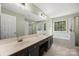 Well-lit primary bathroom with double sinks, garden tub and separate shower at 220 Glenville Dr, Fort Mill, SC 29715