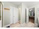 Bright bathroom features a shower with a glass door, linen closet, and access to the main bedroom at 220 Glenville Dr, Fort Mill, SC 29715