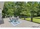 Inviting deck featuring a cozy seating area with an outdoor rug and comfortable patio furniture at 220 Glenville Dr, Fort Mill, SC 29715