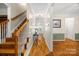 Bright hallway with hardwood floors, staircase, and tasteful décor at 220 Glenville Dr, Fort Mill, SC 29715