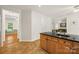 Kitchen with a large island, granite countertop, tile flooring and neutral paint at 220 Glenville Dr, Fort Mill, SC 29715